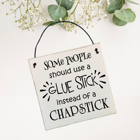 Some people should use a glue stick instead of a chapstick | Wall Plaque
